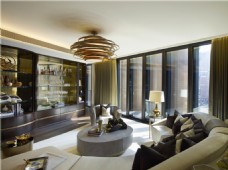 现代奢华客厅圆形铜色吊灯室内装修效果图